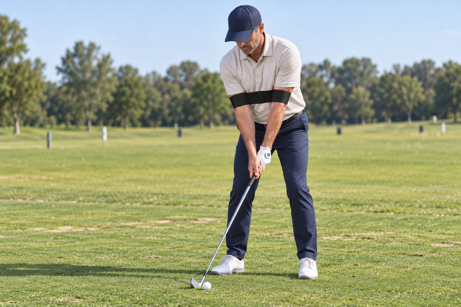 Golfer at address on the range wearing the Connection Band